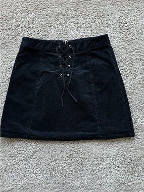 Black corduroy mini skirt with lace-up front